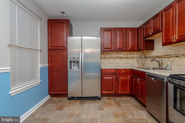 27 Holcumb Ct, Baltimore, MD 21220 - kitchen featuring stainless steel appliances, a sink, dark brown cabinets, and light countertops