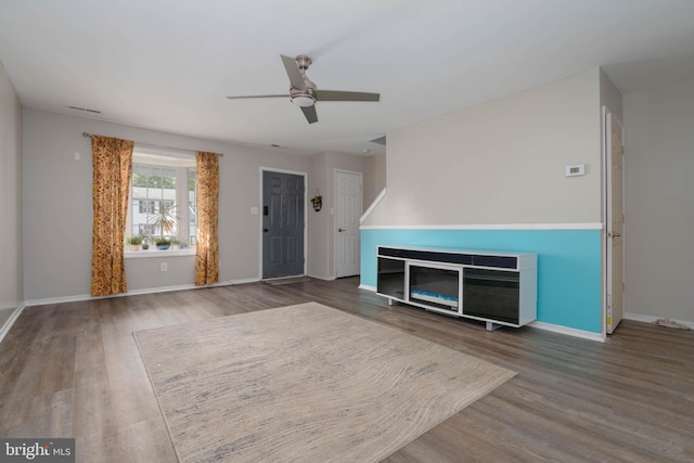 27 Holcumb Ct, Baltimore, MD 21220 - unfurnished living room featuring wood finished floors, a ceiling fan, and baseboards