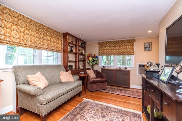1431 Wheatsheaf Ln, Abington, PA 19001 - living room with healthy amount of natural light, crown molding, wood finished floors, baseboards, and radiator