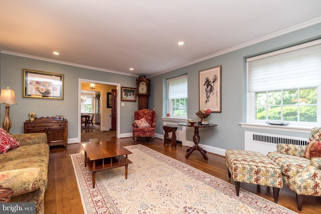 1431 Wheatsheaf Ln, Abington, PA 19001 - living room with radiator heating unit, healthy amount of natural light, wood finished floors, recessed lighting, and crown molding