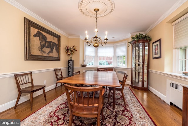 1431 Wheatsheaf Ln, Abington, PA 19001 - dining space featuring plenty of natural light, a chandelier, wood finished floors, and crown molding