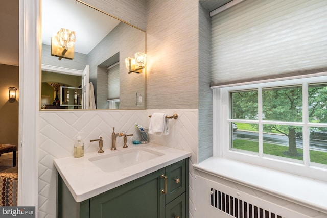 1431 Wheatsheaf Ln, Abington, PA 19001 - bathroom featuring a chandelier, radiator, vanity, and decorative backsplash