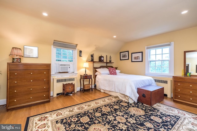 1431 Wheatsheaf Ln, Abington, PA 19001 - bedroom featuring radiator, wood finished floors, cooling unit, vaulted ceiling, and recessed lighting