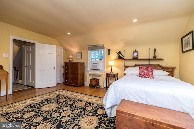 1431 Wheatsheaf Ln, Abington, PA 19001 - bedroom with lofted ceiling, radiator heating unit, wood finished floors, and recessed lighting