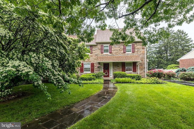 1431 Wheatsheaf Ln, Abington, PA 19001 - view of front of house featuring stone siding, a front yard, and roof with shingles