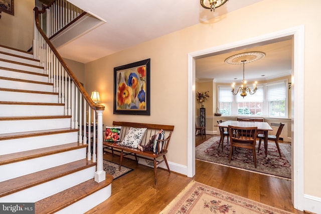 1431 Wheatsheaf Ln, Abington, PA 19001 - entryway with stairs, a chandelier, wood finished floors, baseboards, and crown molding