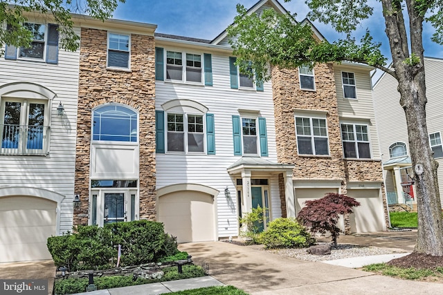 25366 Ashbury, Chantilly, VA 20152 - multi unit property with stone siding, an attached garage, and driveway