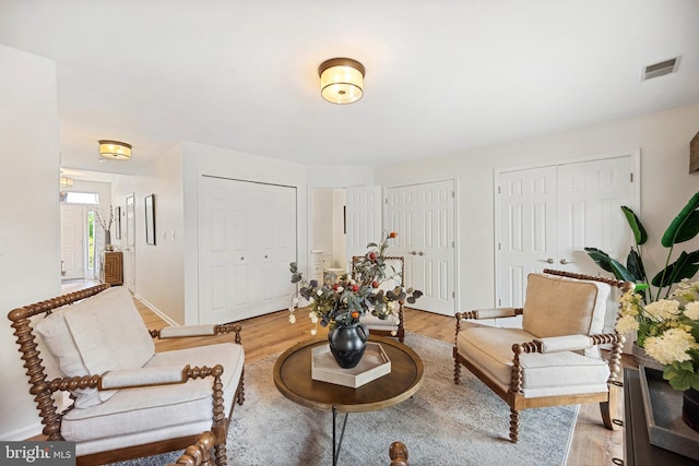 25366 Ashbury, Chantilly, VA 20152 - living area featuring light wood-type flooring and baseboards