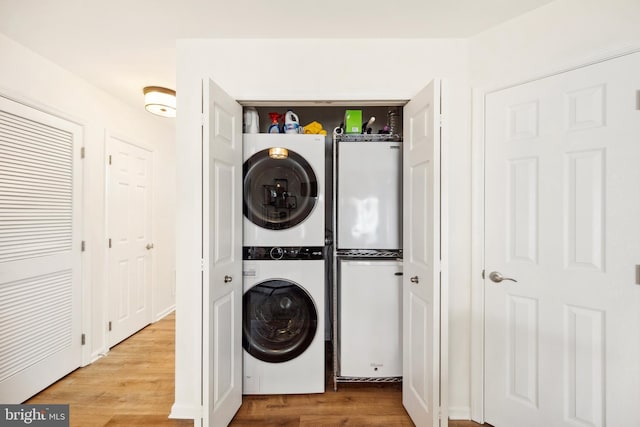 25366 Ashbury, Chantilly, VA 20152 - laundry room with stacked washer / drying machine and wood finished floors