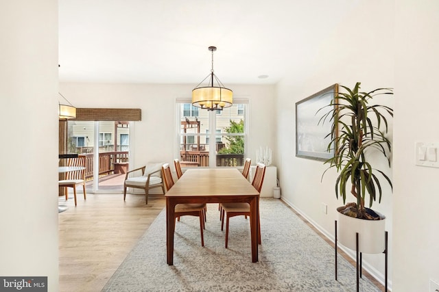 25366 Ashbury, Chantilly, VA 20152 - dining area featuring a chandelier, wood finished floors, and baseboards