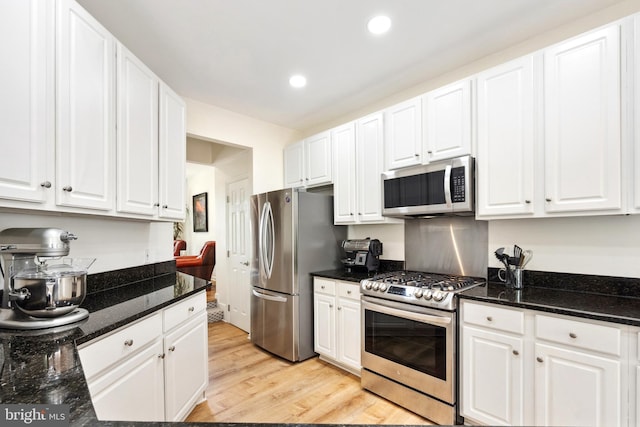 25366 Ashbury, Chantilly, VA 20152 - kitchen with stainless steel appliances, white cabinetry, light wood-style flooring, recessed lighting, and dark stone counters