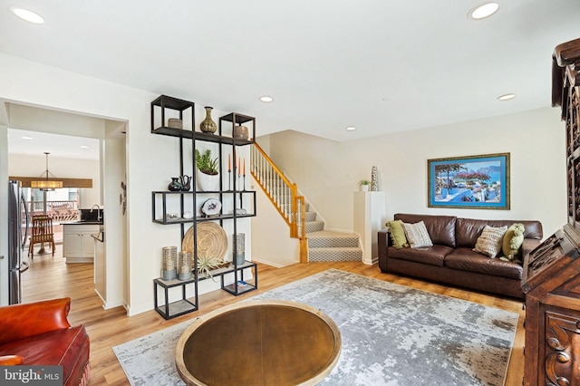 25366 Ashbury, Chantilly, VA 20152 - living room with light wood-type flooring, stairs, a chandelier, recessed lighting, and baseboards