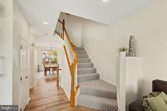 25366 Ashbury, Chantilly, VA 20152 - stairway featuring recessed lighting, wood finished floors, a chandelier, and baseboards