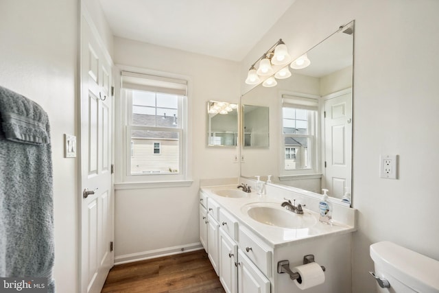 25366 Ashbury, Chantilly, VA 20152 - bathroom with toilet, double vanity, wood finished floors, and baseboards