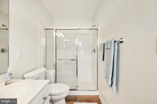 25366 Ashbury, Chantilly, VA 20152 - bathroom featuring toilet, vanity, a stall shower, and wood finished floors