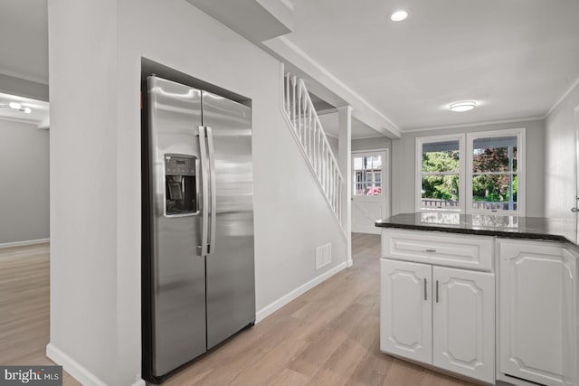 213 Redwood St, Harrisburg, PA 17109 - kitchen with stainless steel fridge, white cabinets, baseboards, light wood-type flooring, and ornamental molding