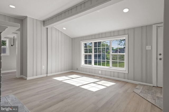 213 Redwood St, Harrisburg, PA 17109 - unfurnished living room with baseboards, wood finished floors, a decorative wall, and recessed lighting