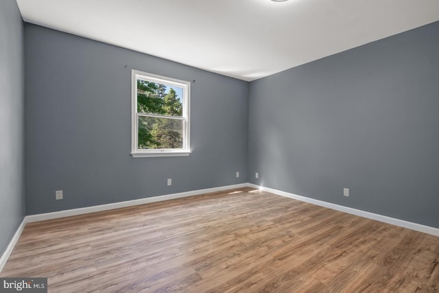213 Redwood St, Harrisburg, PA 17109 - empty room with wood finished floors and baseboards