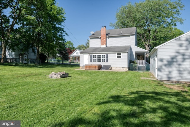 213 Redwood St, Harrisburg, PA 17109 - back of property with a fire pit and a chimney