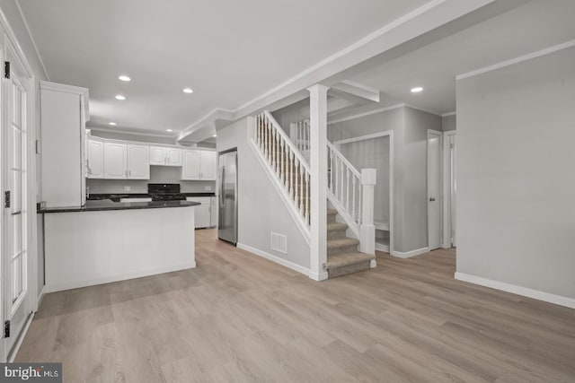 213 Redwood St, Harrisburg, PA 17109 - kitchen featuring stainless steel fridge, white cabinetry, baseboards, a peninsula, and recessed lighting