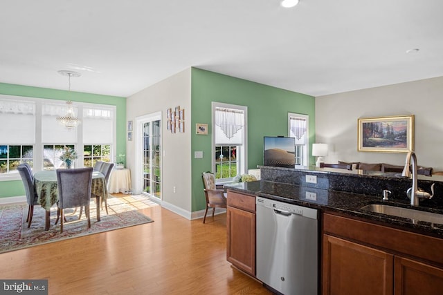 26360 Timbercreek Ln, Millsboro, DE 19966 - kitchen featuring stainless steel dishwasher, a sink, a chandelier, open floor plan, and light wood-style flooring
