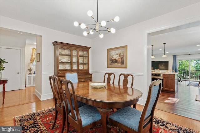 309 Conestoga Rd, Wayne, PA 19087 - dining area featuring light wood finished floors and a chandelier
