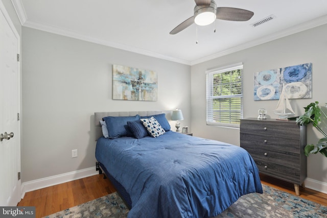 9410 Carleigh Ct, Owings, MD 20736 - bedroom featuring wood finished floors, ornamental molding, baseboards, and ceiling fan