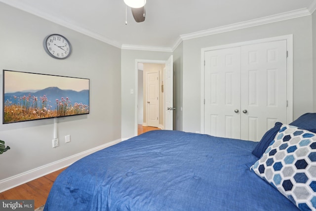 9410 Carleigh Ct, Owings, MD 20736 - bedroom featuring ornamental molding, wood finished floors, a closet, ceiling fan, and baseboards