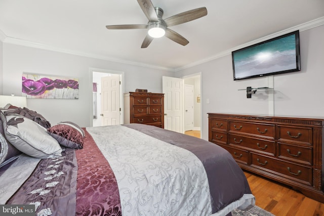 9410 Carleigh Ct, Owings, MD 20736 - bedroom featuring crown molding, light wood-style flooring, and a ceiling fan