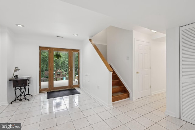 9410 Carleigh Ct, Owings, MD 20736 - foyer featuring stairway, recessed lighting, light tile patterned floors, and baseboards