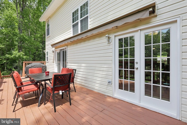 9410 Carleigh Ct, Owings, MD 20736 - wooden terrace featuring french doors and outdoor dining space
