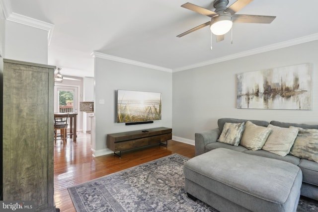 9410 Carleigh Ct, Owings, MD 20736 - living area featuring wood finished floors, ceiling fan, ornamental molding, and baseboards