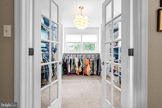 4047 Holly Way, Doylestown, PA 18902 - walk in closet with a chandelier, carpet, and french doors