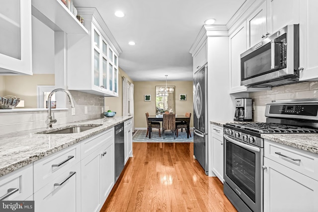 4047 Holly Way, Doylestown, PA 18902 - kitchen with appliances with stainless steel finishes, a sink, white cabinetry, a chandelier, and recessed lighting