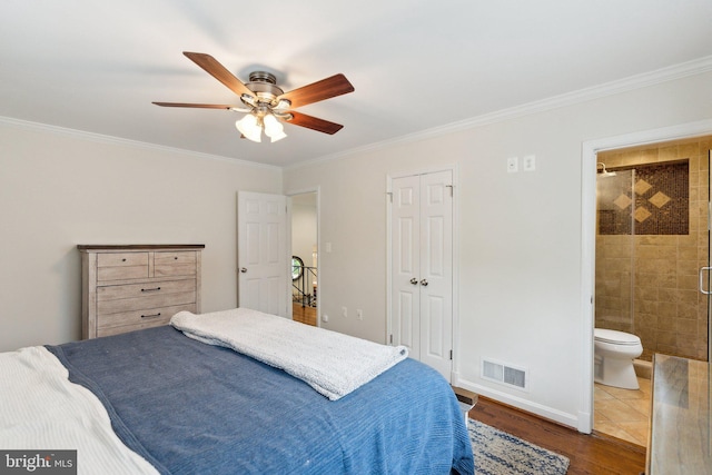 9212 E Parkhill Dr, Bethesda, MD 20814 - bedroom with crown molding, wood finished floors, ensuite bathroom, ceiling fan, and baseboards