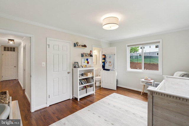 9212 E Parkhill Dr, Bethesda, MD 20814 - bedroom with dark wood finished floors, crown molding, and baseboards