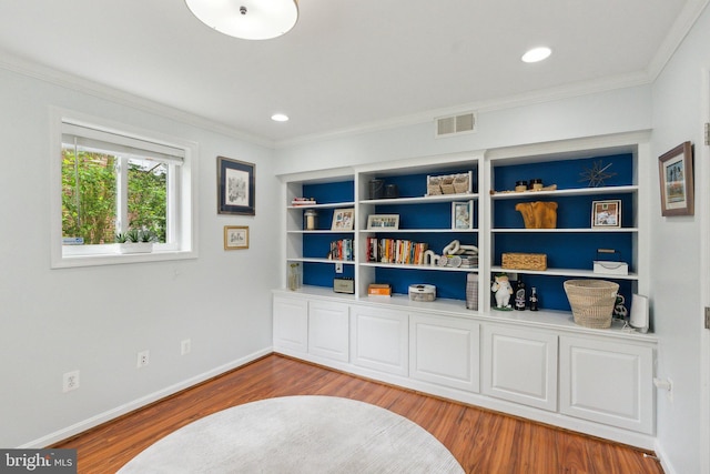 9212 E Parkhill Dr, Bethesda, MD 20814 - living area with ornamental molding, wood finished floors, baseboards, and recessed lighting