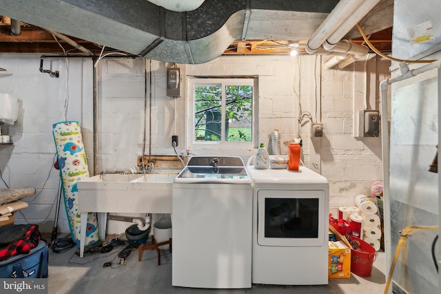 9212 E Parkhill Dr, Bethesda, MD 20814 - laundry room featuring washing machine and dryer and concrete block wall