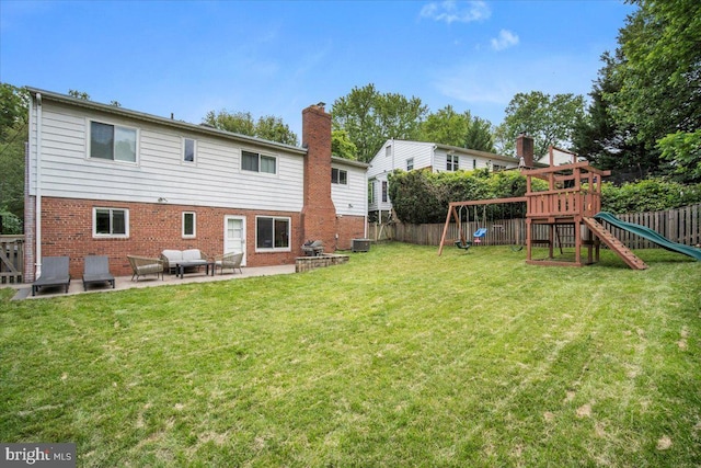 9212 E Parkhill Dr, Bethesda, MD 20814 - back of property featuring a patio, brick siding, a playground, a chimney, and cooling unit