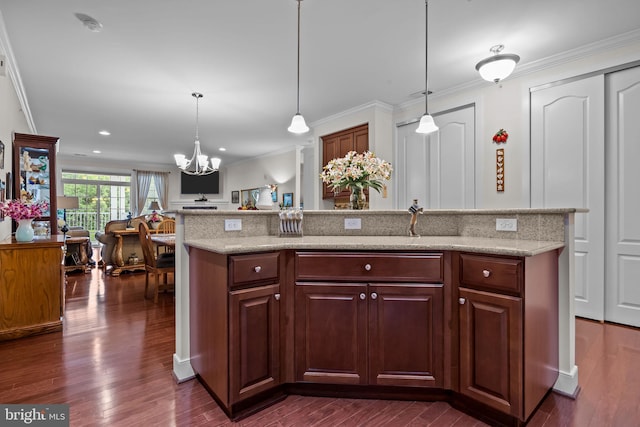 5328 Meridian Blvd, Warrington, PA 18976 - kitchen with crown molding, a chandelier, dark wood-style floors, open floor plan, and pendant lighting