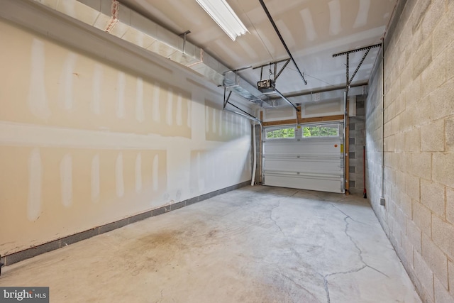 5328 Meridian Blvd, Warrington, PA 18976 - garage featuring a garage door opener and concrete block wall
