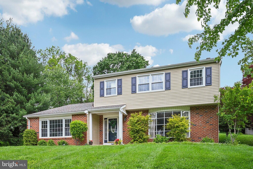 225 Biddle Dr, Exton, PA 19341 - view of front facade featuring brick siding and a front yard