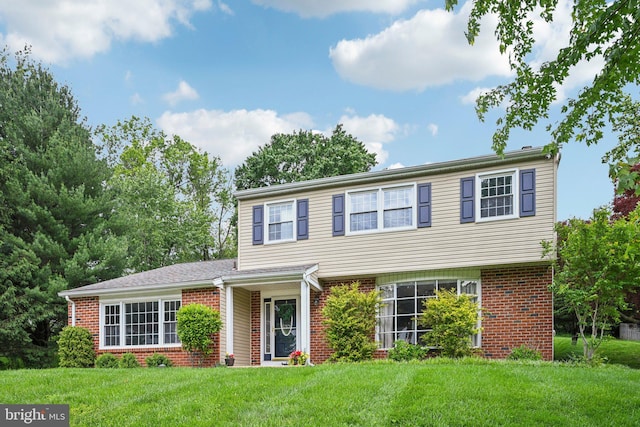 225 Biddle Dr, Exton, PA 19341 - view of front facade featuring brick siding and a front yard