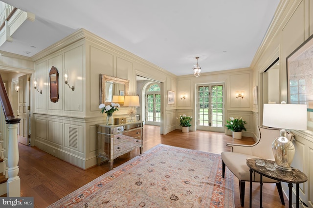 601 Maplewood Rd, Wayne, PA 19087 - sitting room featuring a decorative wall, wood finished floors, and ornamental molding