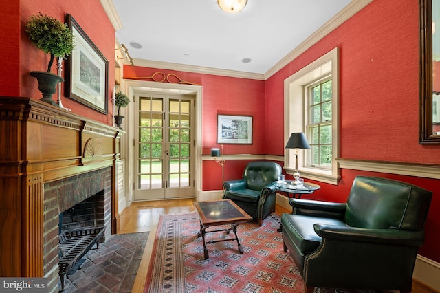 601 Maplewood Rd, Wayne, PA 19087 - living area with ornamental molding, a fireplace with flush hearth, french doors, wood finished floors, and baseboards