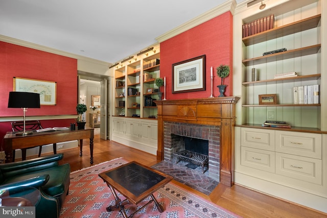 601 Maplewood Rd, Wayne, PA 19087 - living room with crown molding, wood finished floors, built in shelves, a brick fireplace, and an office area
