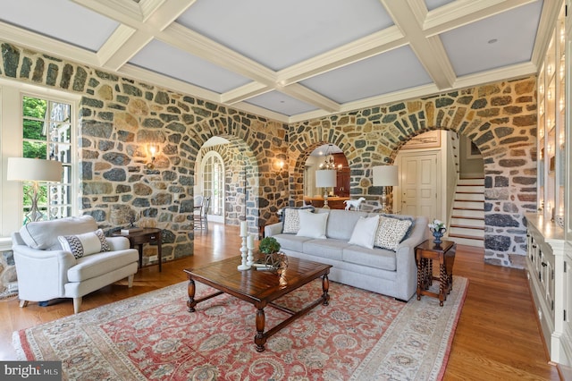 601 Maplewood Rd, Wayne, PA 19087 - living area featuring arched walkways, coffered ceiling, stairway, beamed ceiling, and wood finished floors
