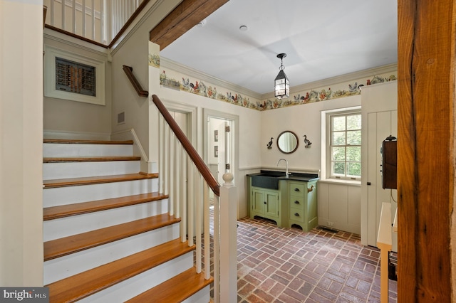 601 Maplewood Rd, Wayne, PA 19087 - staircase featuring brick floors