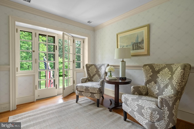 601 Maplewood Rd, Wayne, PA 19087 - living area featuring wallpapered walls, wood finished floors, and crown molding
