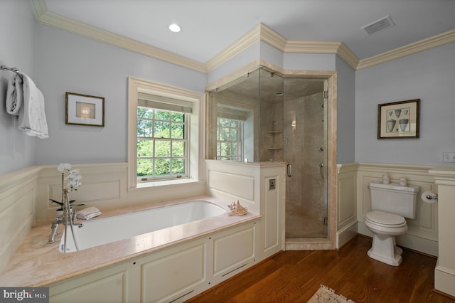 601 Maplewood Rd, Wayne, PA 19087 - full bath with a bath, toilet, a shower stall, a wainscoted wall, and wood finished floors